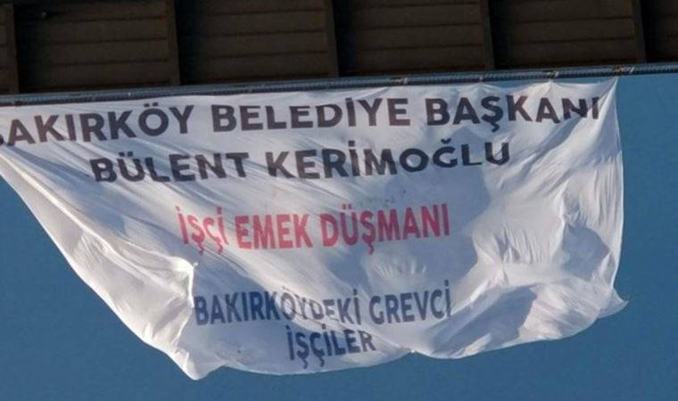 Grevde olan Bakırköy Belediyesi işçileri 15 Temmuz Şehitler Köprüsü'ne pankart astı