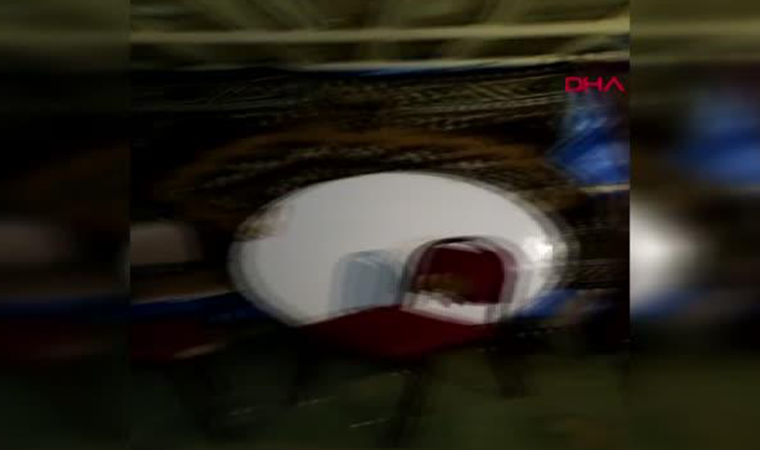 İzmir'de boş arazide kurulan çadırda skandal görüntüler