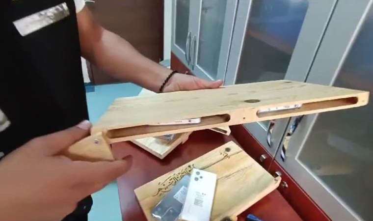 Akılalmaz yöntem: Kargo ile gönderilen rahlelerden 'kaçak telefon' çıktı