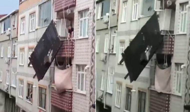 Çatıdan parça koptu... Çamaşır ipinde asılı kaldı