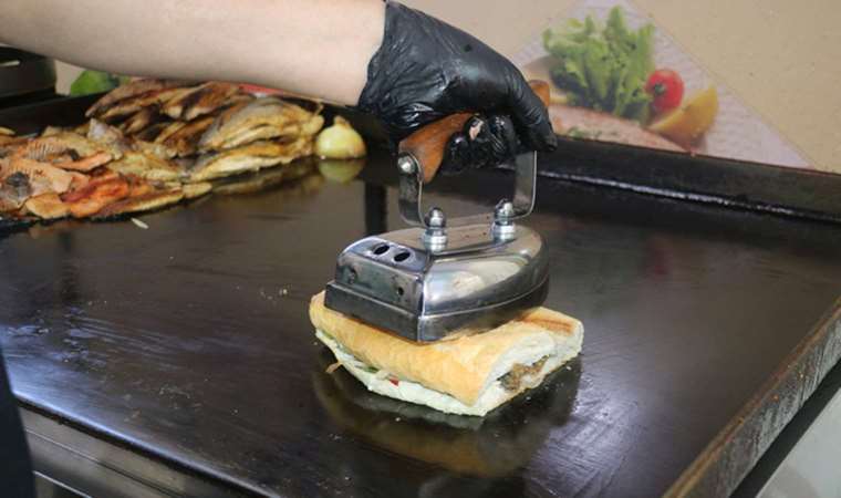 Sivas'ta bir balık restoranı balığı ütü ile pişiriyor!