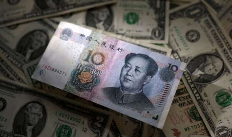 Exclusive: China's state banks seen selling dollars for yuan in London and New York hours