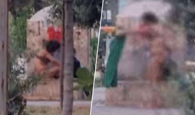 Çocuk parkında iç çamaşırlarıyla banyo yaptı
