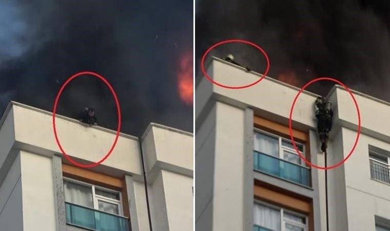 Korku dolu anlar: İtfaiyeci kendini hortumla aşağı bıraktı